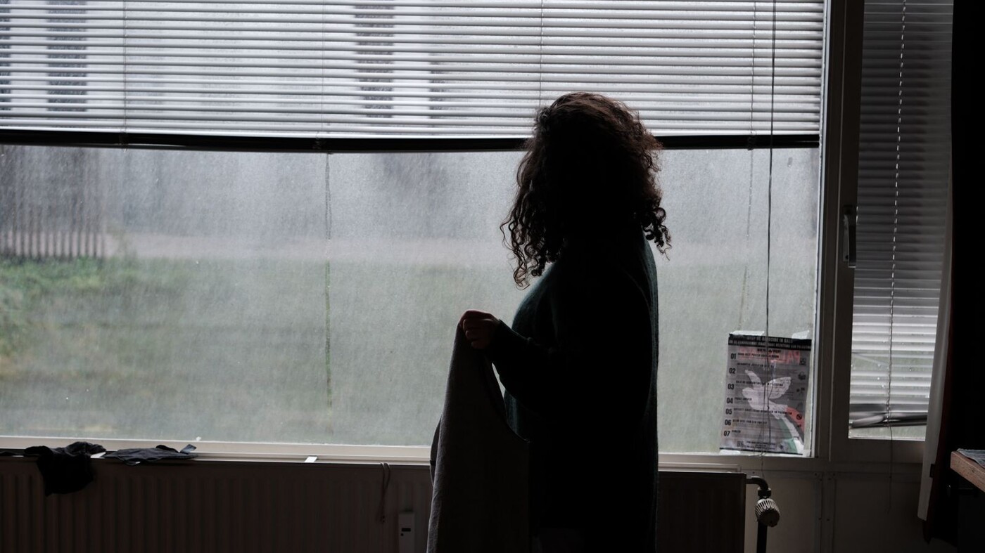 Isabella in front of her window